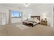 Elegant main bedroom with a luxurious bed and plenty of space at 9540 E Spiral Ave, Mesa, AZ 85212