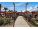 Outdoor dining area with tables, chairs, and umbrellas at 9540 E Spiral Ave, Mesa, AZ 85212