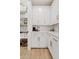 Walk-in pantry with white cabinets and ample shelving at 9540 E Spiral Ave, Mesa, AZ 85212