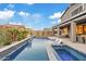 Luxury backyard with a large pool, spa, and fire pit at 9540 E Spiral Ave, Mesa, AZ 85212