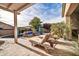 Relaxing pool area with lounge chairs and a pergola at 9825 W Desert Elm Ln, Peoria, AZ 85383