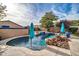 Refreshing pool with blue umbrellas and lounge chairs at 9825 W Desert Elm Ln, Peoria, AZ 85383