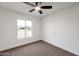 Bright bedroom with ceiling fan and large window at 1015 W Minton Dr, Tempe, AZ 85282