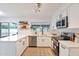 Modern white kitchen with stainless steel appliances and ample counter space at 1015 W Minton Dr, Tempe, AZ 85282