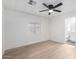 Bright bedroom with light wood flooring and ceiling fan at 1031 S 98Th St, Mesa, AZ 85208