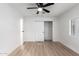 Light and airy bedroom with ceiling fan and sliding door closet at 1031 S 98Th St, Mesa, AZ 85208