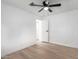 Bright bedroom with ceiling fan and door to hallway at 1031 S 98Th St, Mesa, AZ 85208