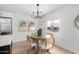 Dining area with round table and modern chandelier at 1031 S 98Th St, Mesa, AZ 85208