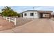 Front view of updated manufactured home with carport at 1031 S 98Th St, Mesa, AZ 85208