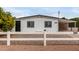 White single story home with carport and fenced yard at 1031 S 98Th St, Mesa, AZ 85208