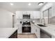 White kitchen with stainless steel appliances and quartz countertops at 1031 S 98Th St, Mesa, AZ 85208