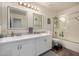 Bathroom with double sinks and a shower/tub combo at 10617 W Adela Dr, Peoria, AZ 85383