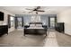 Bright bedroom featuring a ceiling fan and large windows at 10617 W Adela Dr, Peoria, AZ 85383