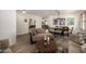 Open dining area with wood table and chairs, adjacent to living room at 10617 W Adela Dr, Peoria, AZ 85383