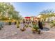 Landscaped backyard with desert plants and water fountain at 1075 W Desert Aster Rd, San Tan Valley, AZ 85143