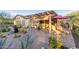 Outdoor living space featuring a pergola, seating, and water feature at 1075 W Desert Aster Rd, San Tan Valley, AZ 85143