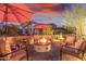 Outdoor patio featuring fire pit and comfortable seating at 1075 W Desert Aster Rd, San Tan Valley, AZ 85143