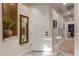 Bright entryway with a mirror, built-in shelving, and view into hallway at 1075 W Desert Aster Rd, San Tan Valley, AZ 85143