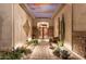 Elegant entryway with a courtyard featuring brick pavers and desert plants at 1075 W Desert Aster Rd, San Tan Valley, AZ 85143