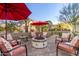 Cozy fire pit surrounded by comfortable seating at 1075 W Desert Aster Rd, San Tan Valley, AZ 85143