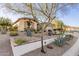 Desert landscaping with agave plants, cacti, and gravel surrounds this single-story home at 1075 W Desert Aster Rd, San Tan Valley, AZ 85143