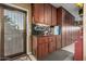 Organized garage with storage cabinets and workbench at 1075 W Desert Aster Rd, San Tan Valley, AZ 85143