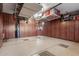 Garage interior with overhead storage and ample shelving at 1075 W Desert Aster Rd, San Tan Valley, AZ 85143