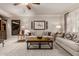 Relaxing living room with two sofas, coffee table, and area rug at 1075 W Desert Aster Rd, San Tan Valley, AZ 85143