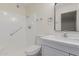 Clean bathroom with a shower/tub combo, white vanity, and modern mirror at 11440 N Hagen Dr, Sun City, AZ 85351