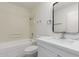 Modern bathroom with white vanity, quartz countertop, and a bathtub at 11440 N Hagen Dr, Sun City, AZ 85351