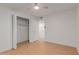 Simple bedroom with light walls, wood flooring, and a double-door closet at 11440 N Hagen Dr, Sun City, AZ 85351