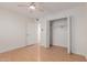 Bright bedroom with wood flooring, a closet, and ceiling fan at 11440 N Hagen Dr, Sun City, AZ 85351