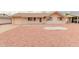 Ranch style home with a large front yard and a two-car garage at 11440 N Hagen Dr, Sun City, AZ 85351