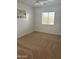 Spacious carpeted bedroom with neutral walls and ceiling fan at 11621 W Cheryl Dr, Youngtown, AZ 85363