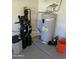 Image shows the home's water softener, filtration system, and water heater located in the basement at 1223 E Villa Rita Dr, Phoenix, AZ 85022