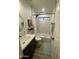 Bathroom with marble tile, bathtub, and modern vanity at 1223 E Villa Rita Dr, Phoenix, AZ 85022