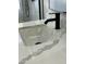 Modern bathroom sink with quartz countertop and black faucet at 1223 E Villa Rita Dr, Phoenix, AZ 85022