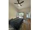 Bedroom with sliding glass door to patio, and ceiling fan at 1223 E Villa Rita Dr, Phoenix, AZ 85022