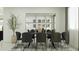 Modern dining room with black chairs and a dark wood table at 12517 W Trumbull Rd, Avondale, AZ 85323