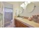 Clean bathroom with double vanity and a large mirror at 12605 E Kalil Dr, Scottsdale, AZ 85259