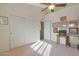 Well-lit bedroom with double door closet and wall decor at 12605 E Kalil Dr, Scottsdale, AZ 85259