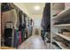 Large walk-in closet with ample shelving and hanging space at 12605 E Kalil Dr, Scottsdale, AZ 85259