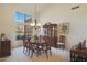 Formal dining room features a large table, buffet, and chandelier at 12605 E Kalil Dr, Scottsdale, AZ 85259