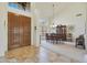 Bright entryway with tile flooring, double doors, and views into the dining area at 12605 E Kalil Dr, Scottsdale, AZ 85259