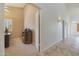 Bright hallway with tile flooring, leading to other rooms at 12605 E Kalil Dr, Scottsdale, AZ 85259