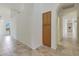 Hallway with tile flooring and built-in storage at 12605 E Kalil Dr, Scottsdale, AZ 85259