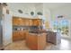 Bright kitchen with granite countertops and island at 12605 E Kalil Dr, Scottsdale, AZ 85259