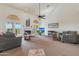 Spacious living room with fireplace and large windows at 12605 E Kalil Dr, Scottsdale, AZ 85259