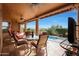 Outdoor patio with seating, pool view, and ceiling fans at 12605 E Kalil Dr, Scottsdale, AZ 85259