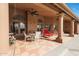 Relaxing covered patio with seating and ceiling fans at 12605 E Kalil Dr, Scottsdale, AZ 85259